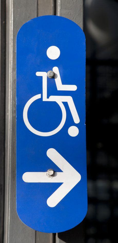 Blue Disabled Sign on Building Entrance
